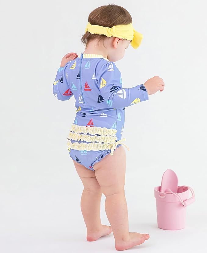 RuffleButts Baby Girls UPF 50+ Sun Protection Novelty Print Long Sleeve One Piece Rash Guard Swimsuit with Zipper