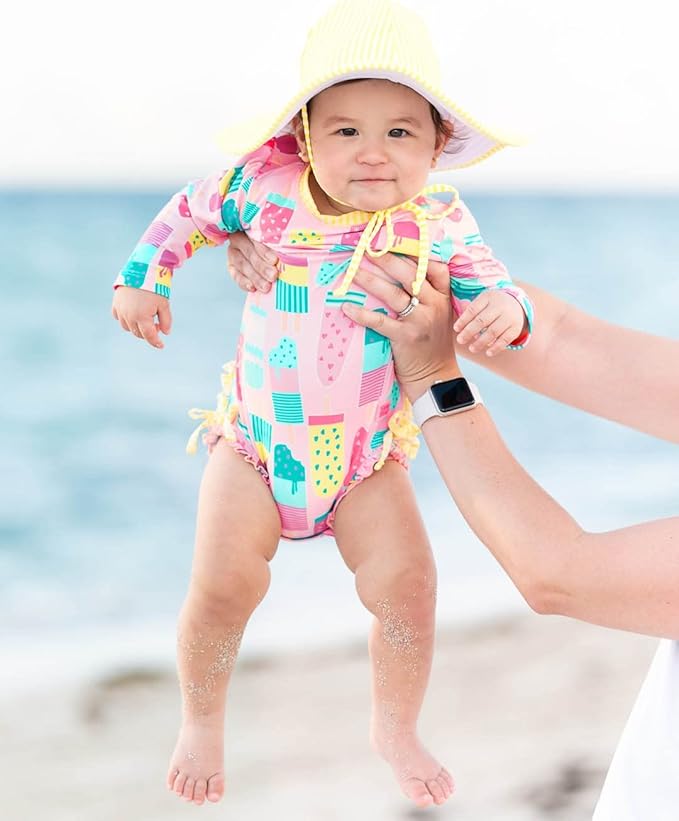 RuffleButts Baby Girls UPF 50+ Sun Protection Novelty Print Long Sleeve One Piece Rash Guard Swimsuit with Zipper