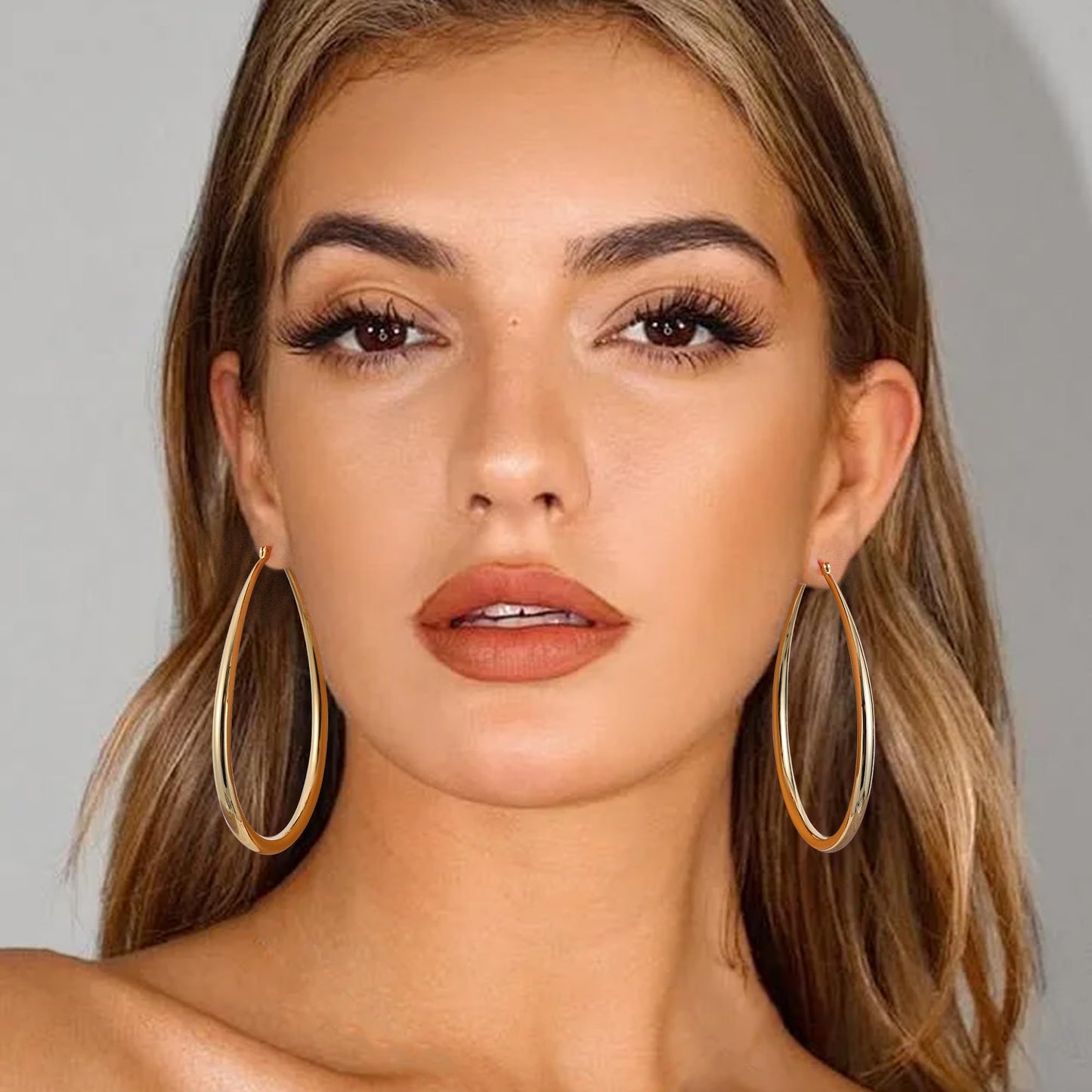 Gacimy Gold Chunky Hoop Earrings for Women, 14K Gold Plated Oval Hoop Big Earrings with 925 Sterling Silver Post, 70mm Yellow Co