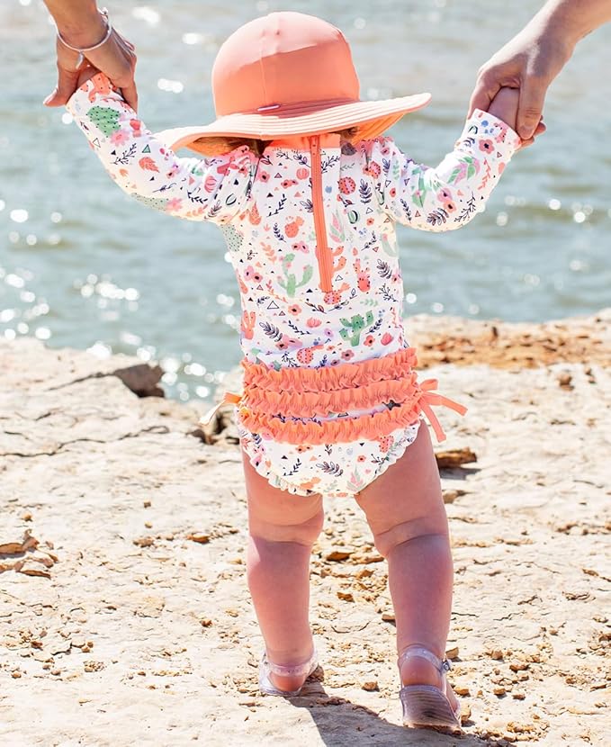 RuffleButts Baby Girls UPF 50+ Sun Protection Novelty Print Long Sleeve One Piece Rash Guard Swimsuit with Zipper