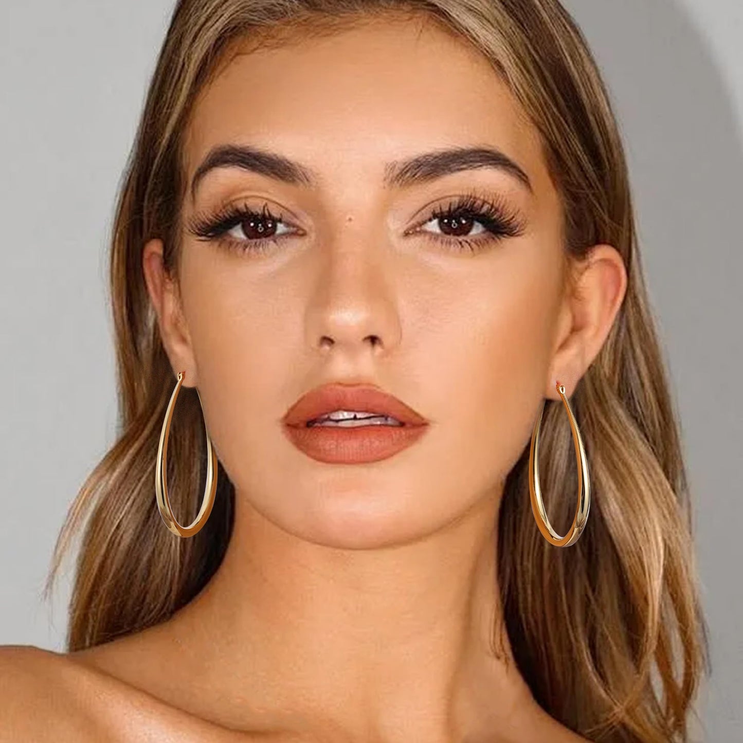 Gacimy Gold Chunky Hoop Earrings for Women, 14K Gold Plated Oval Hoop Big Earrings with 925 Sterling Silver Post, 60mm Yellow Co