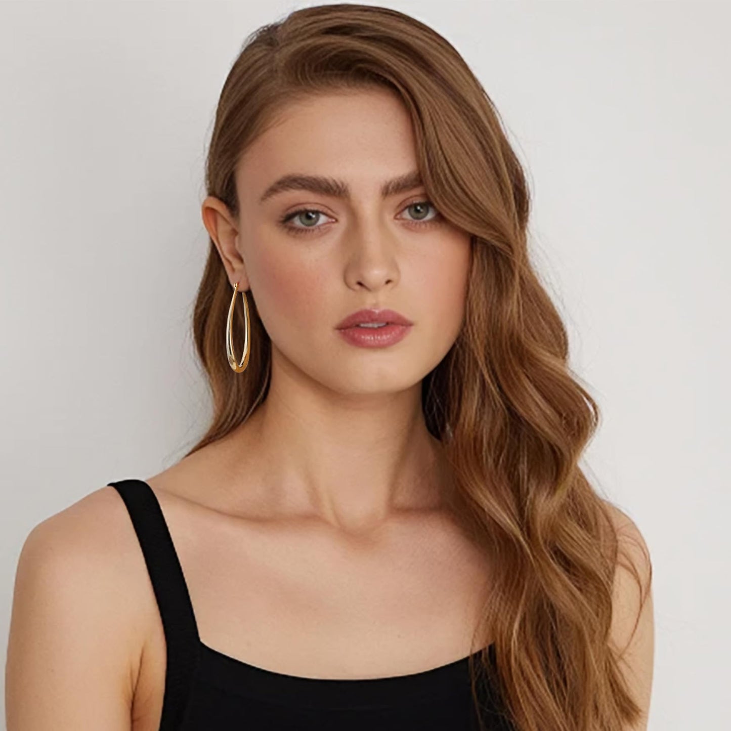 Gacimy Gold Chunky Hoop Earrings for Women, 14K Gold Plated Oval Hoop Big Earrings with 925 Sterling Silver Post, 50mm Yellow Co
