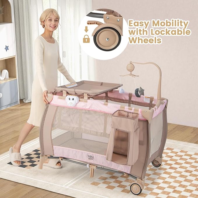 Costzon 3 in 1 Pink Pack and Play with Bassinet, Portable Baby Playard with Changing Table, Music Box, Whirling Toys, Wheels/Brake, Basket, Bag, Foldable Infant Pink Bassinet for Baby Girl Toddlers
