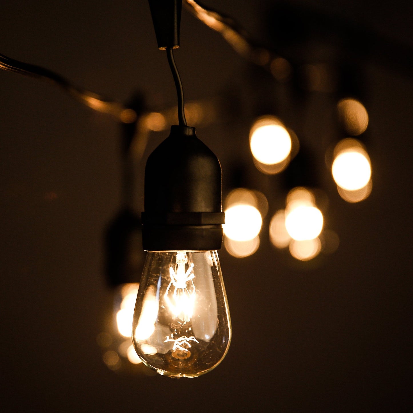Hometown Evolution  Inc. 50 Foot E26 Commercial Outdoor String Lights With 25 Suspended Sockets And S14 Clear Bulbs For Weatherproof Heavy Duty Vintage Outside Lighting
