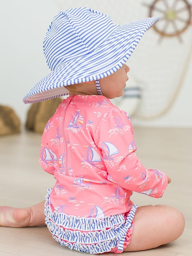 RuffleButts Baby Girls UPF 50+ Sun Protection Novelty Print Long Sleeve One Piece Rash Guard Swimsuit with Zipper