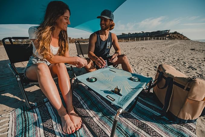 Neso Portable Beach Table with Cup Holders, Cell Phone Pockets, Lightweight for Picnics and Parks (Aqua Fronds)