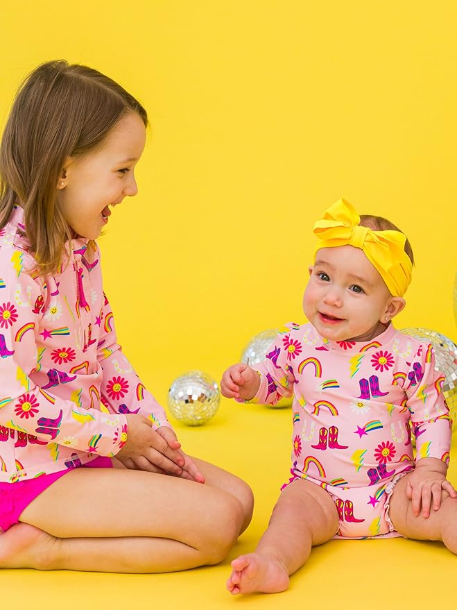 RuffleButts Baby Girls UPF 50+ Sun Protection Novelty Print Long Sleeve One Piece Rash Guard Swimsuit with Zipper