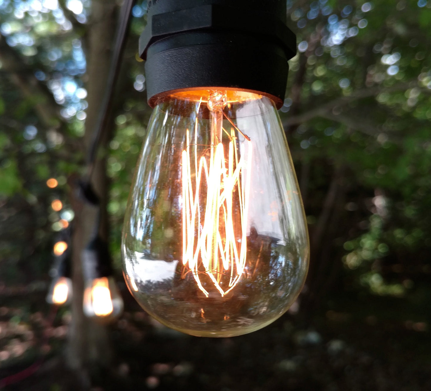 Hometown Evolution  Inc. E26 Outdoor Commercial String Lights With Suspended Socket For Weatherproof Heavy Duty Vintage Outside Lighting (S14 Lantern Edison 11 Watt Bulbs  24 Foot 12 Socket)